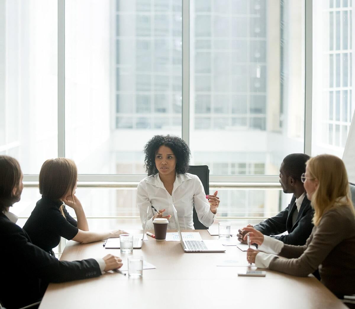 Young woman leading a business meeting
