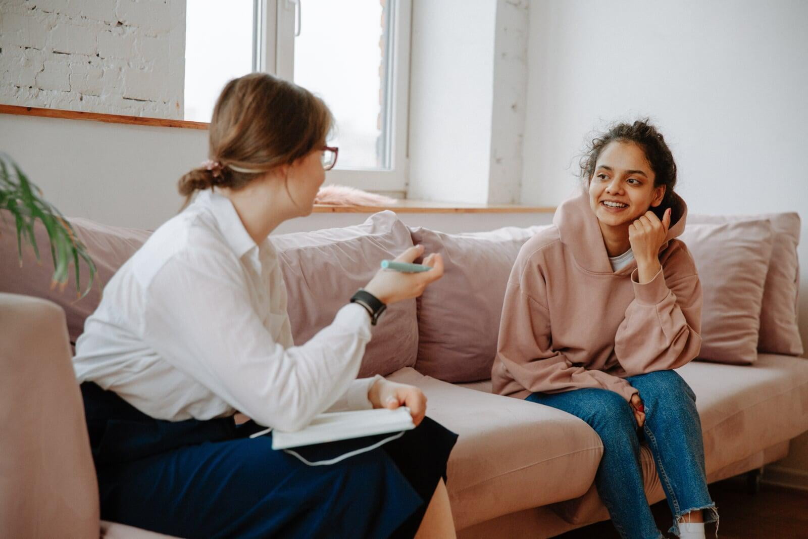 Female counselor meeting with a young girl